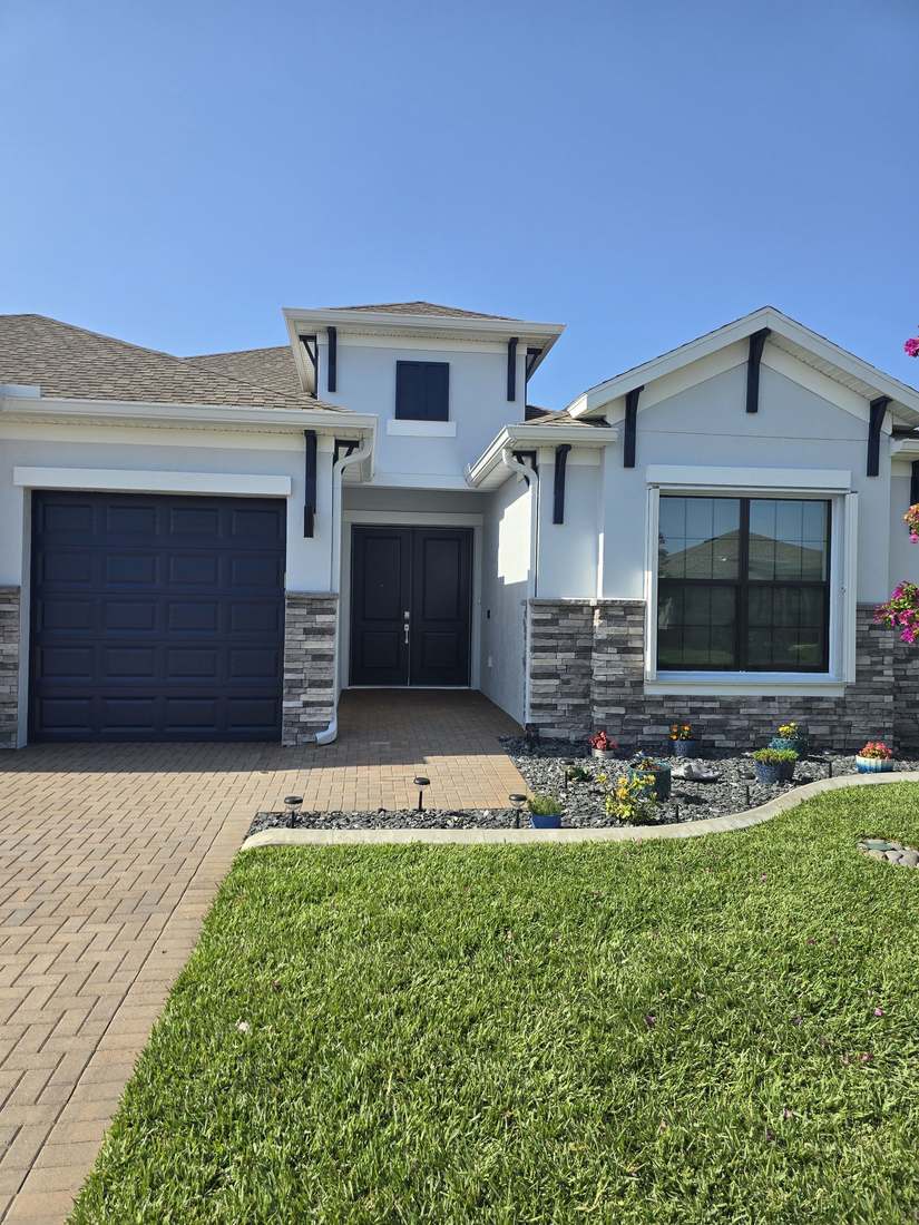 Repainted three-story coastal home exterior