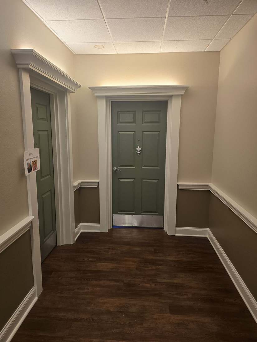Freshly painted hallway with green doors
